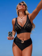High-waisted ruched two-piece bikini set with cutout detail, trendy swimwear by Trendsi, featuring a stylish and flattering design.