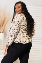Honey print plunge neck tie-front peplum blouse for women, stylish and feminine Trendsi apparel, shown with tied front detail.