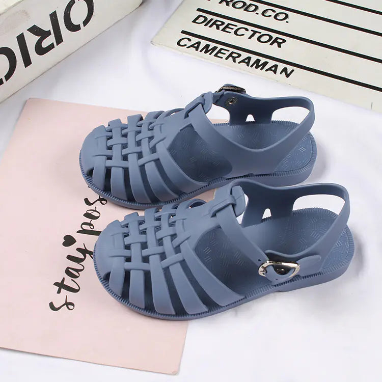 Girls hollow casual flat sandals from Trendy Attic Store01, featuring open-toe design and comfortable flat soles.