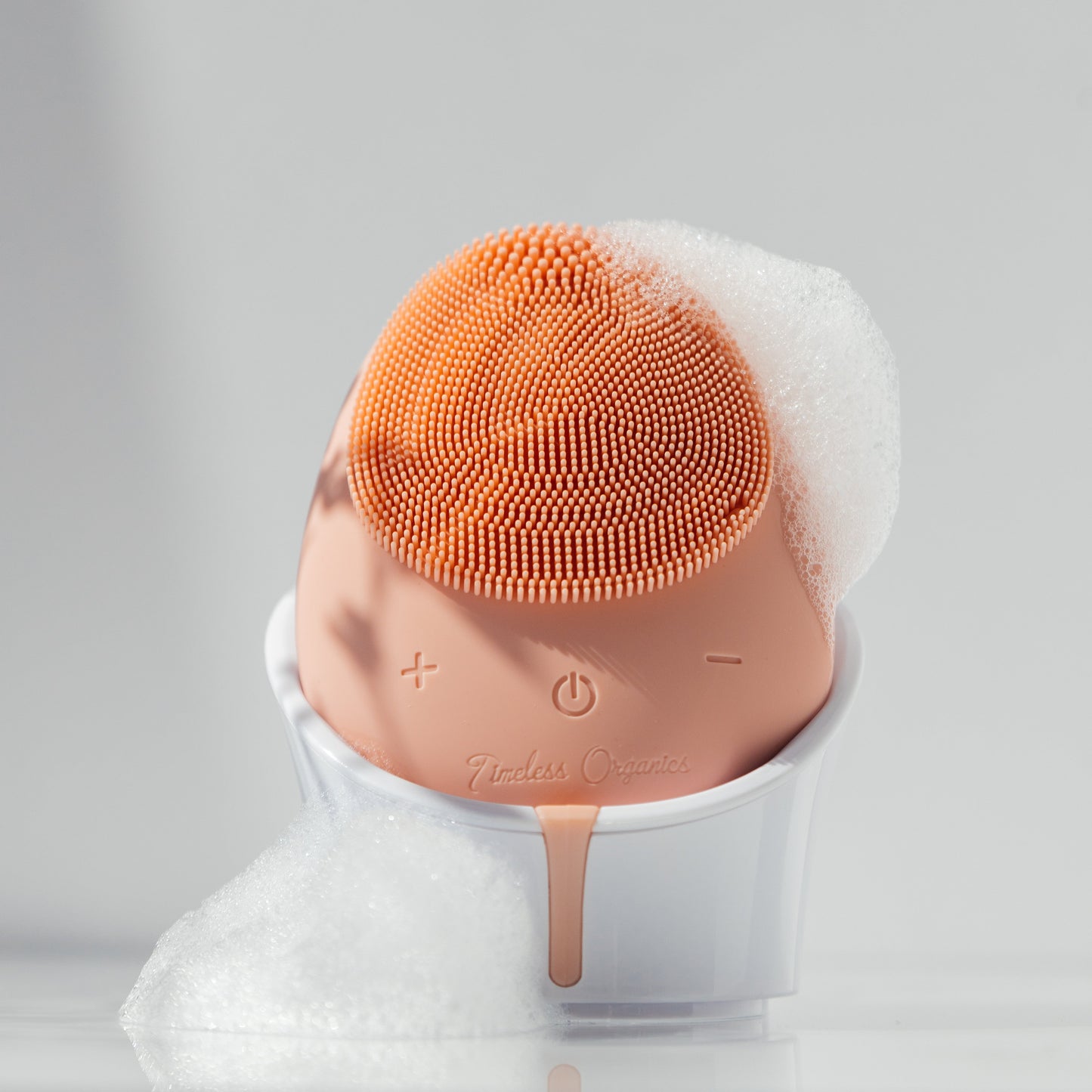 Plush Fashion Hub Timeless Facial Cleansing Brush device with soft bristles for gentle skin cleansing and exfoliation.