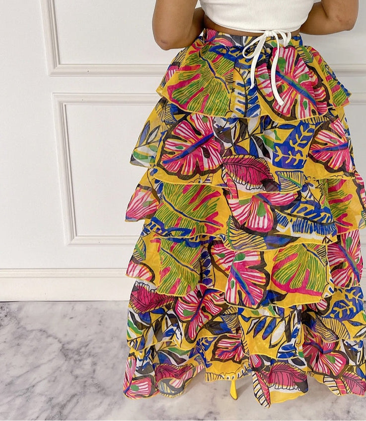 Fasheabe Blissful Views printed ruffled high-low skirt with flowing fabric and ruffle details, styled as a fashionable women's bottom.