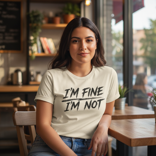 Wear Your Worship "I'm Fine. I'm Not." T-shirt from The Weight Collection featuring a casual, black graphic tee with bold text.
