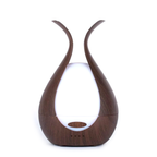 Timeless Organics Skin Care diffuser for beauty, featuring a sleek design with natural wooden accents and a modern aesthetic.