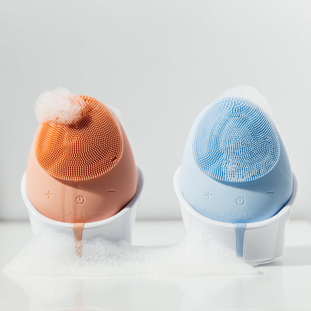 Timeless Organics Skin Care facial cleansing brush device with soft bristles for gentle skin cleansing and exfoliation.