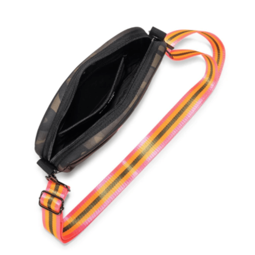 Inside view of a Threaded Pear neoprene crossbody bag showing its interior compartment and design details.