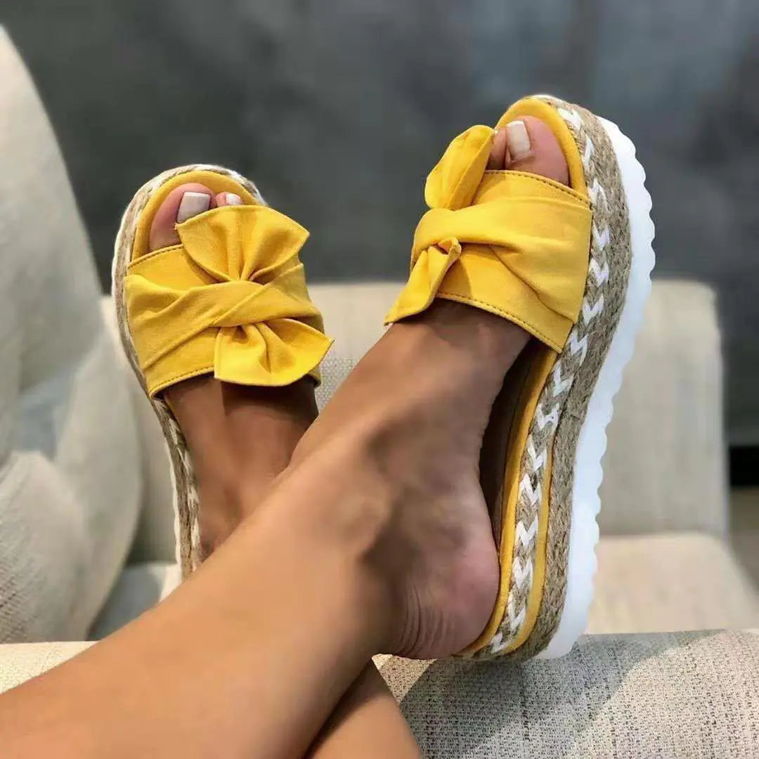 Women’s bow sandals with platform wedge heel from Trendy Attic Store01, featuring stylish straps and a comfortable, trendy design.