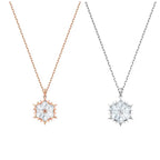Snowflake necklace with silver chain and diamond pendant, featuring a delicate, sparkling winter-inspired design.