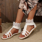 Women's lace open toe flat sandals by Trendsi featuring PU leather and intricate lace details, perfect for summer footwear.