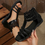 Women's lace open toe flat sandals made of PU leather with intricate lace details, perfect for summer casual wear.