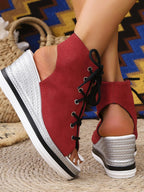 Women's lace-up open toe wedge sandals with a mid-heel, featuring comfortable design and stylish summer shoe look.