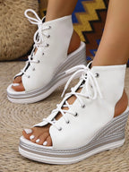 Women's lace-up open toe wedge sandals with comfortable mid-heel design, perfect for summer, by Trendsi.