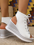 Women's lace-up open toe wedge sandals with mid-height heel, featuring a stylish design and comfortable fit for summer wear.