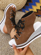 Women's lace-up open toe wedge sandals with mid-heel, designed for summer comfort, featuring stylish straps and a trendy look.