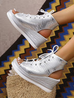 Women's lace-up open toe wedge sandals with mid-heels, featuring comfortable design and stylish summer shoe style.