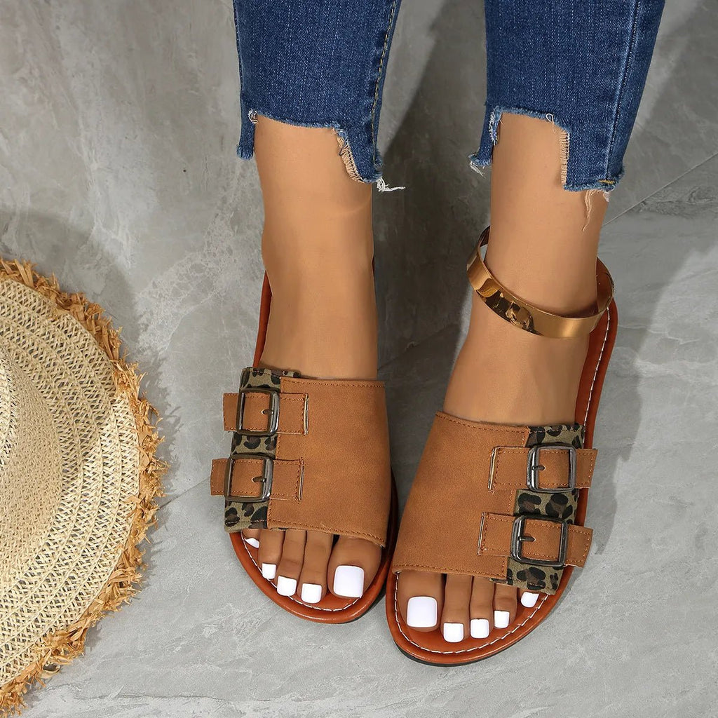 Women's leopard print open toe flat sandals by Trendsi, featuring comfortable casual summer shoes with stylish animal print design.