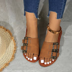 Women's leopard print open toe flat sandals by Trendsi, featuring comfortable casual summer shoes with stylish animal print design.