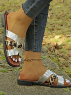 Women's leopard print buckle strap sandals with a comfortable low heel, perfect for summer fashion and casual wear.