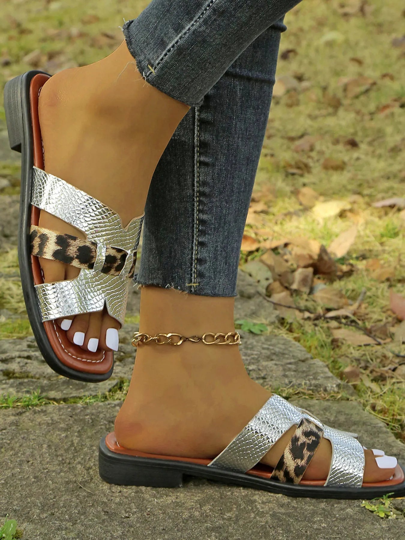 Women's leopard print buckle strap sandals with a comfortable low heel, perfect for summer fashion and casual wear.