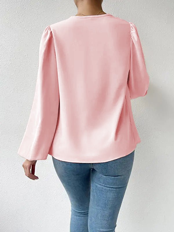 Loose Bella Mia long-sleeved V-neck shirt with draped design, casual women’s top, perfect for everyday wear.