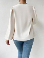 Bella Mia long-sleeved loose draped V-neck top for women, casual T-shirt with relaxed fit and stylish neckline.