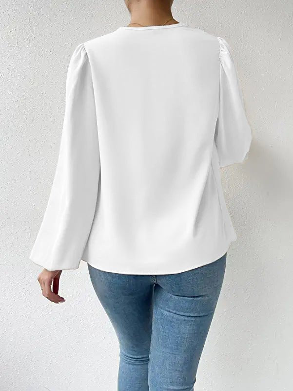 Loose draped V-neck long-sleeved shirt for women by Bella Mia, featuring a relaxed fit and stylish design.