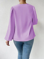 Loose long-sleeved V-neck shirt for women with draped fit, stylish Bella Mia top ideal for casual or dressy occasions.