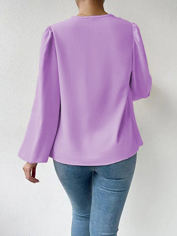 Loose long-sleeved V-neck shirt for women with draped fit, stylish Bella Mia top ideal for casual or dressy occasions.