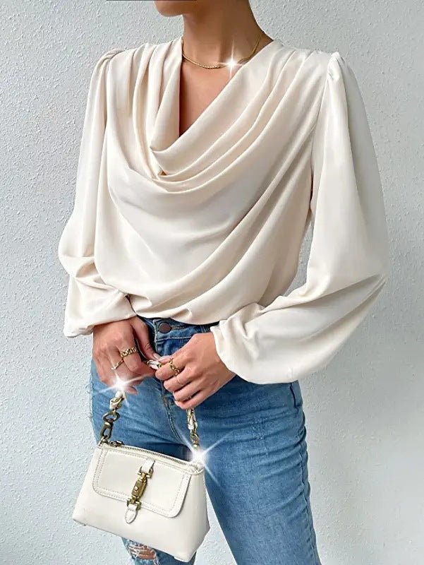 Loose draped V-neck long-sleeved shirt for women, Bella Mia, casual top with relaxed fit and stylish design.