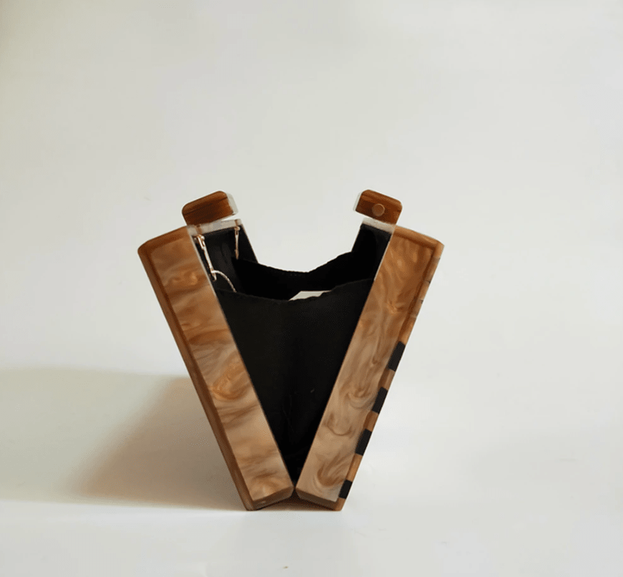 Black Luxe Clutch by Plush Fashion Hub, featuring a sleek elegant design with a textured finish and a sophisticated metal clasp.