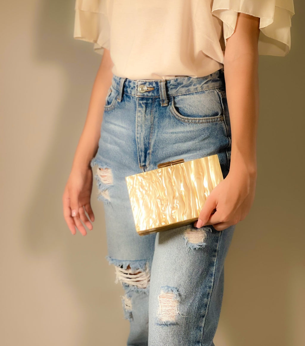 Black Luxe Clutch from Plush Fashion Hub featuring sleek design and elegant craftsmanship for evening occasions.