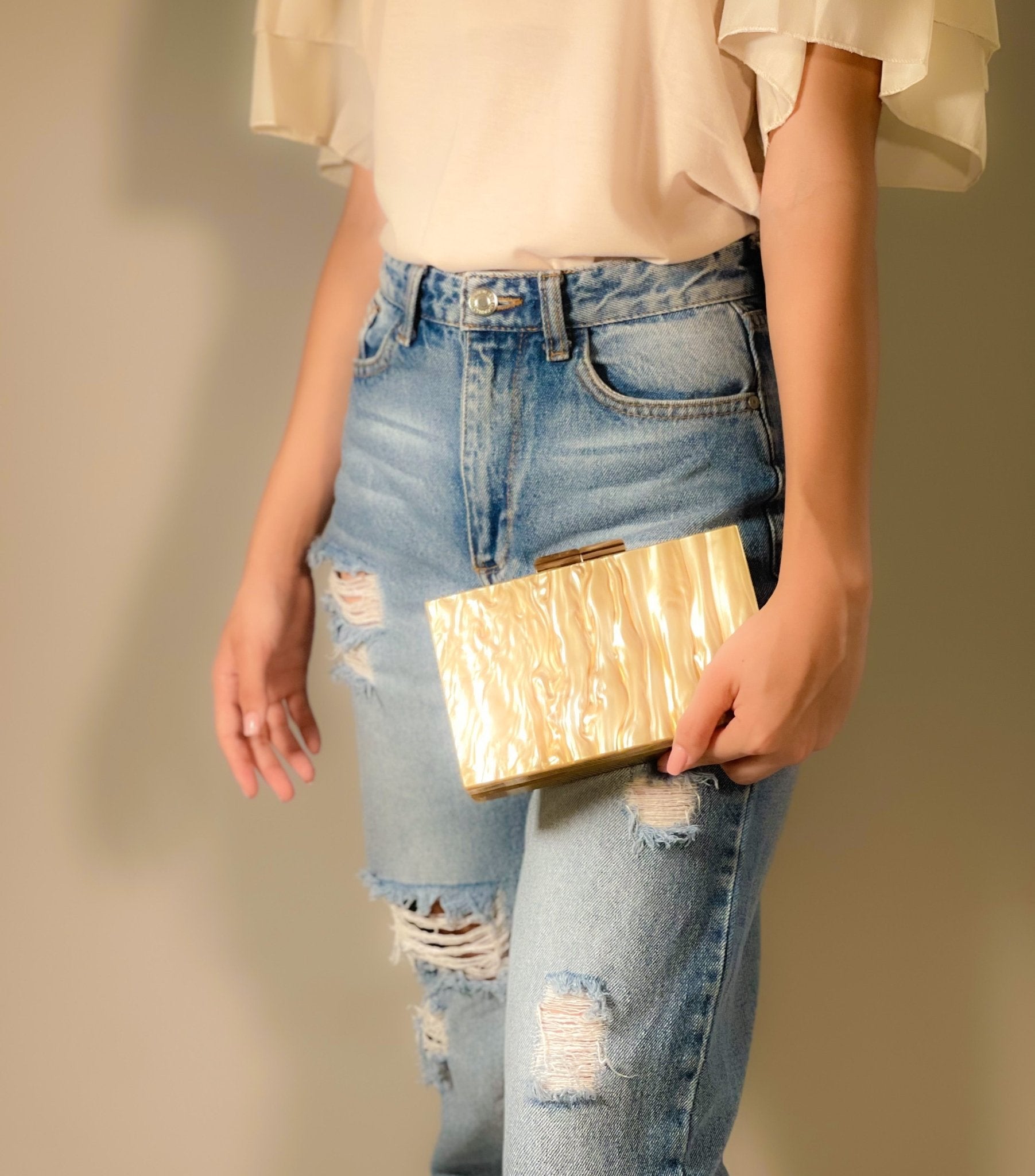 Black Luxe Clutch from Plush Fashion Hub featuring sleek design and elegant craftsmanship for evening occasions.