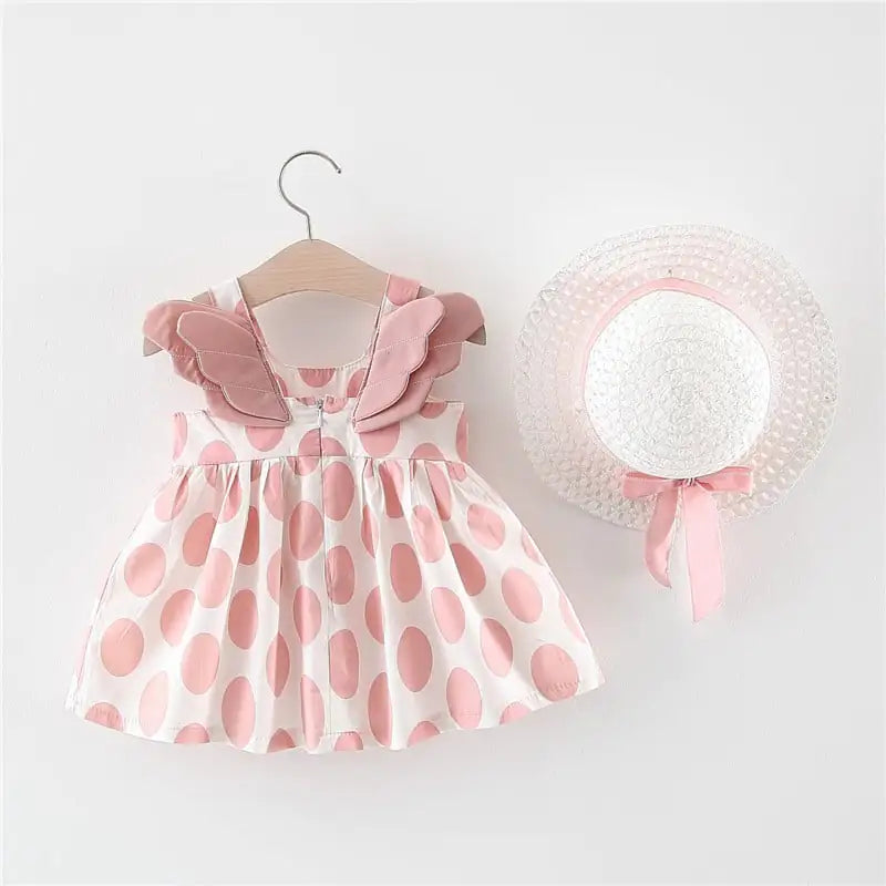 Girls summer princess dress with large polka dots and matching hat, featuring wings for a whimsical, fairy-tale look.