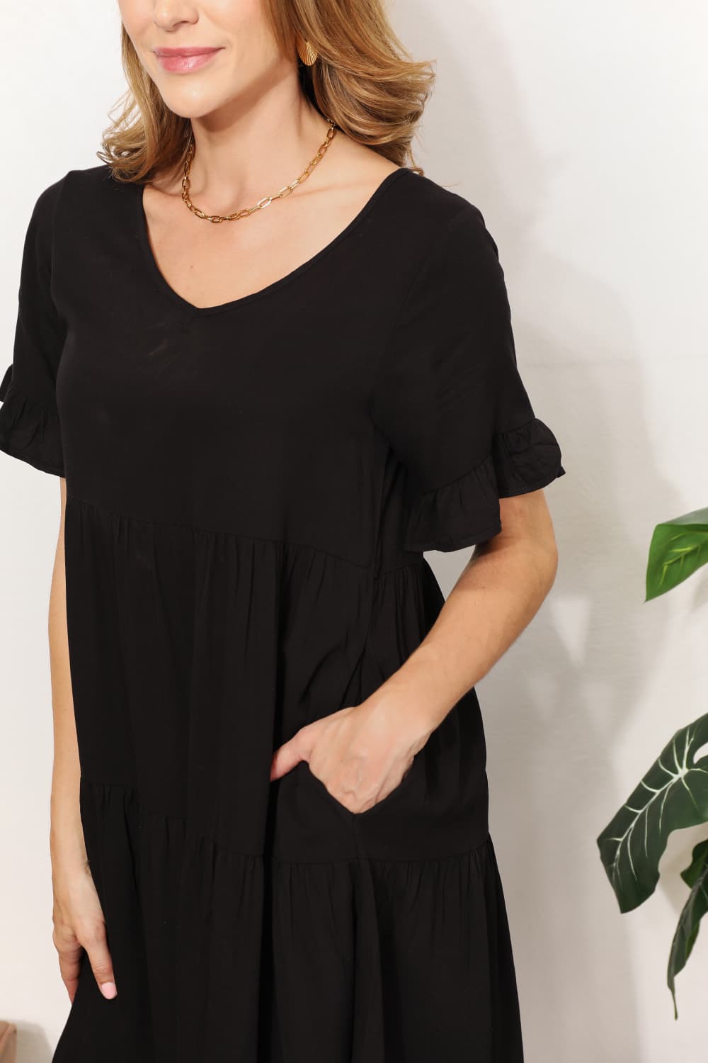 Mandy Women's solid V-neck tiered casual dress with flounce sleeves, stylish and comfortable women’s apparel by Trendsi.