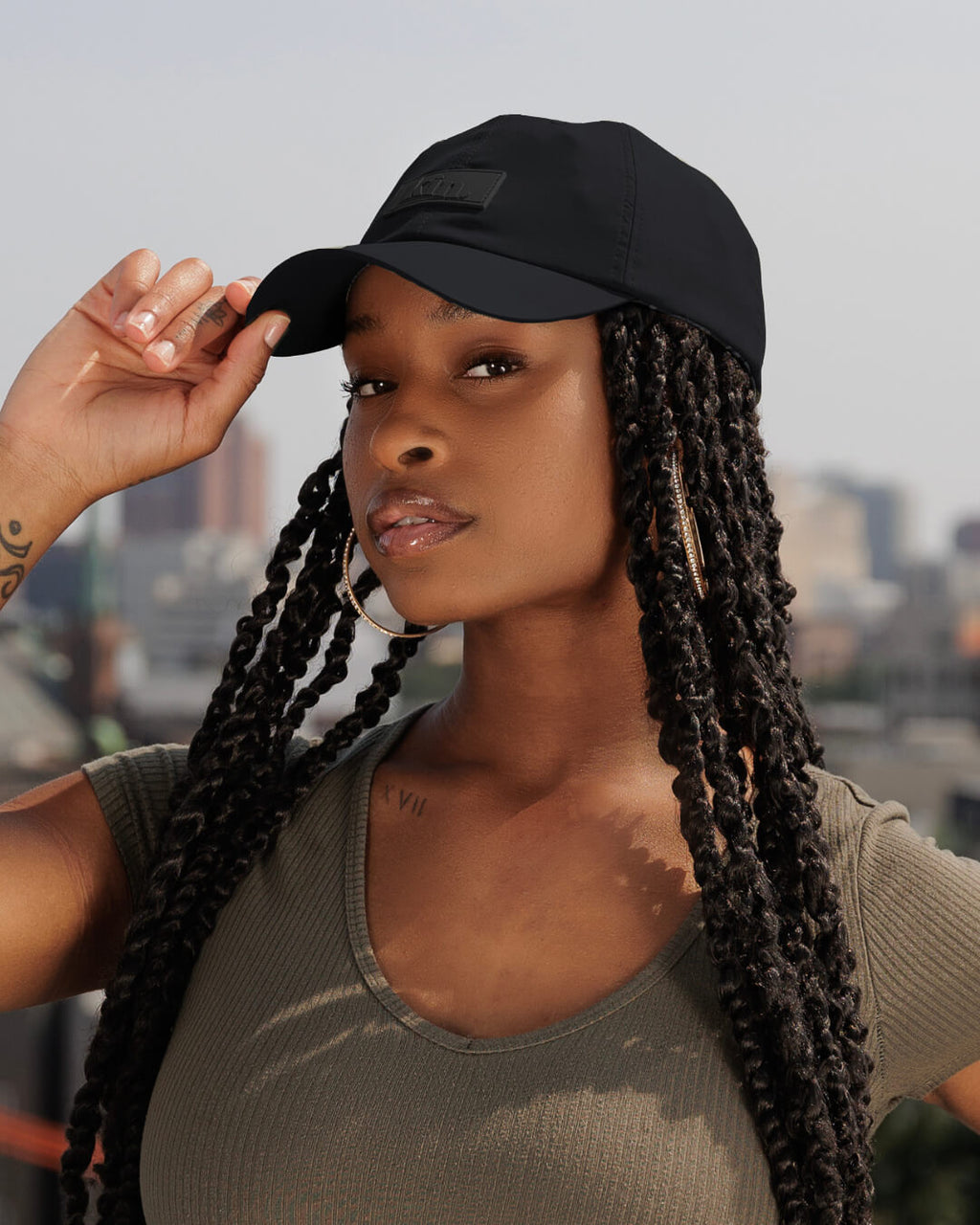 Black waterproof satin-lined dad hat by Plush Fashion Hub, featuring a classic brim and adjustable strap for casual style.