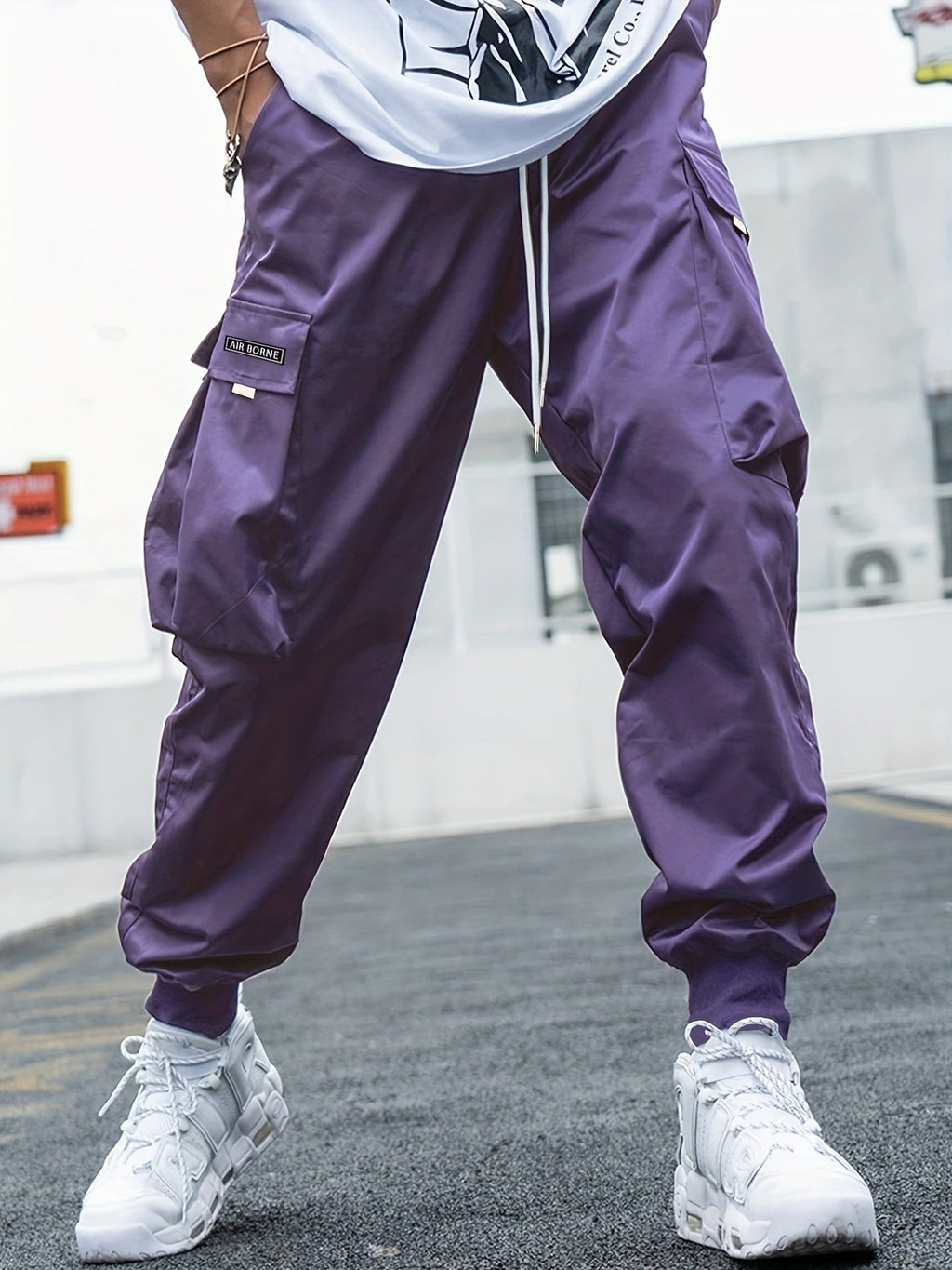 Men’s multi-pocket drawstring cargo pants from Plush Fashion Hub featuring streetwear style and multiple functional pockets.
