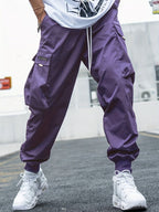 Men’s multi-pocket drawstring cargo pants from Plush Fashion Hub featuring streetwear style and multiple functional pockets.