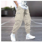 Men’s multi-pocket drawstring cargo pants in streetwear style by Plush Fashion Hub, showing the relaxed fit and multiple utility pockets.