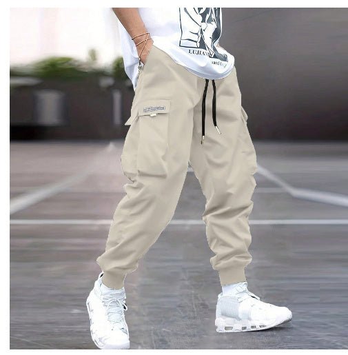 Men’s multi-pocket drawstring cargo pants in streetwear style by Plush Fashion Hub, showing the relaxed fit and multiple utility pockets.