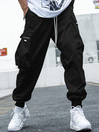Men’s multi-pocket drawstring cargo pants from Plush Fashion Hub, streetwear style with multiple pockets and adjustable drawstring waist.