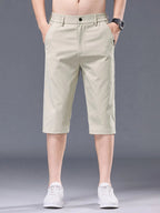 Men's plus size casual stretch shorts with pockets, comfortable and versatile men's shorts by Trendsi, suitable for everyday wear.