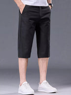 Men's plus size casual stretch shorts with front and back pockets, comfortable and versatile men's shorts by Trendsi.