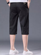 Plus size men's casual stretch shorts with pockets, featuring a comfortable fit and versatile design by Trendsi.