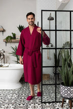 Men's plush waffle spa bathrobe from Plush Fashion Hub, lightweight and absorbent, shown with matching slippers.