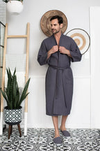 Men's waffle spa bathrobe by Plush Fashion Hub, lightweight and absorbent, shown hanging with a soft textured fabric.