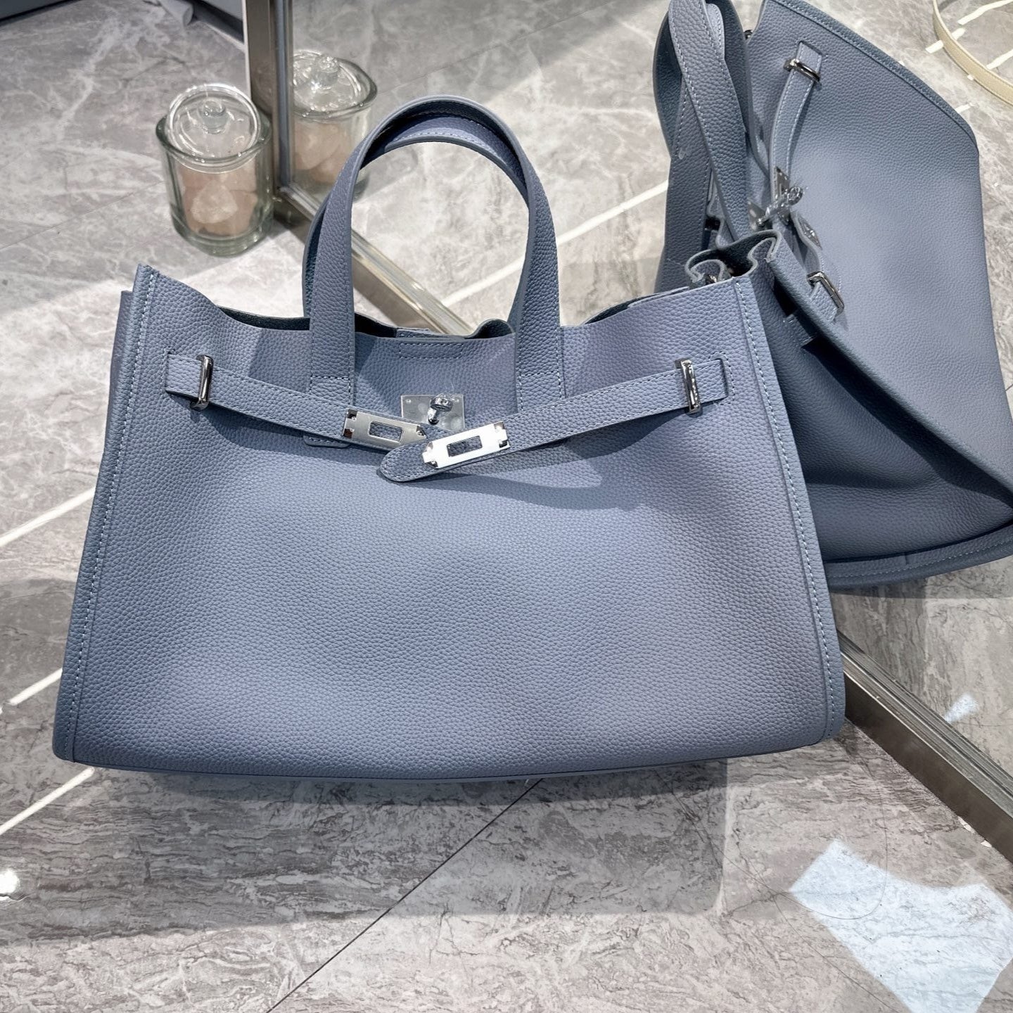 Black cowhide crossbody bag for women with adjustable strap, featuring a sleek, all-match design from Plush Fashion Hub.