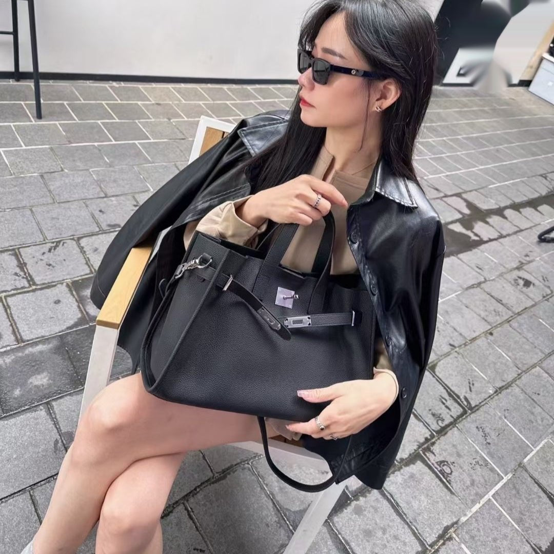 New top layer cowhide crossbody bag for women, stylish all-match design with adjustable strap and compact size.