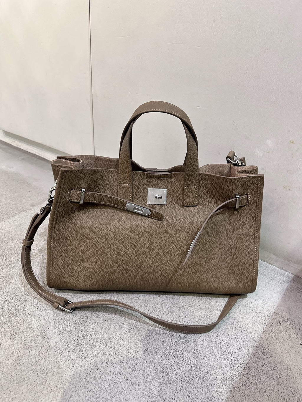 Black cowhide crossbody bag for women with adjustable strap, featuring a sleek all-match design from Plush Fashion Hub.