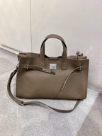 Black cowhide crossbody bag for women with adjustable strap, featuring a sleek all-match design from Plush Fashion Hub.