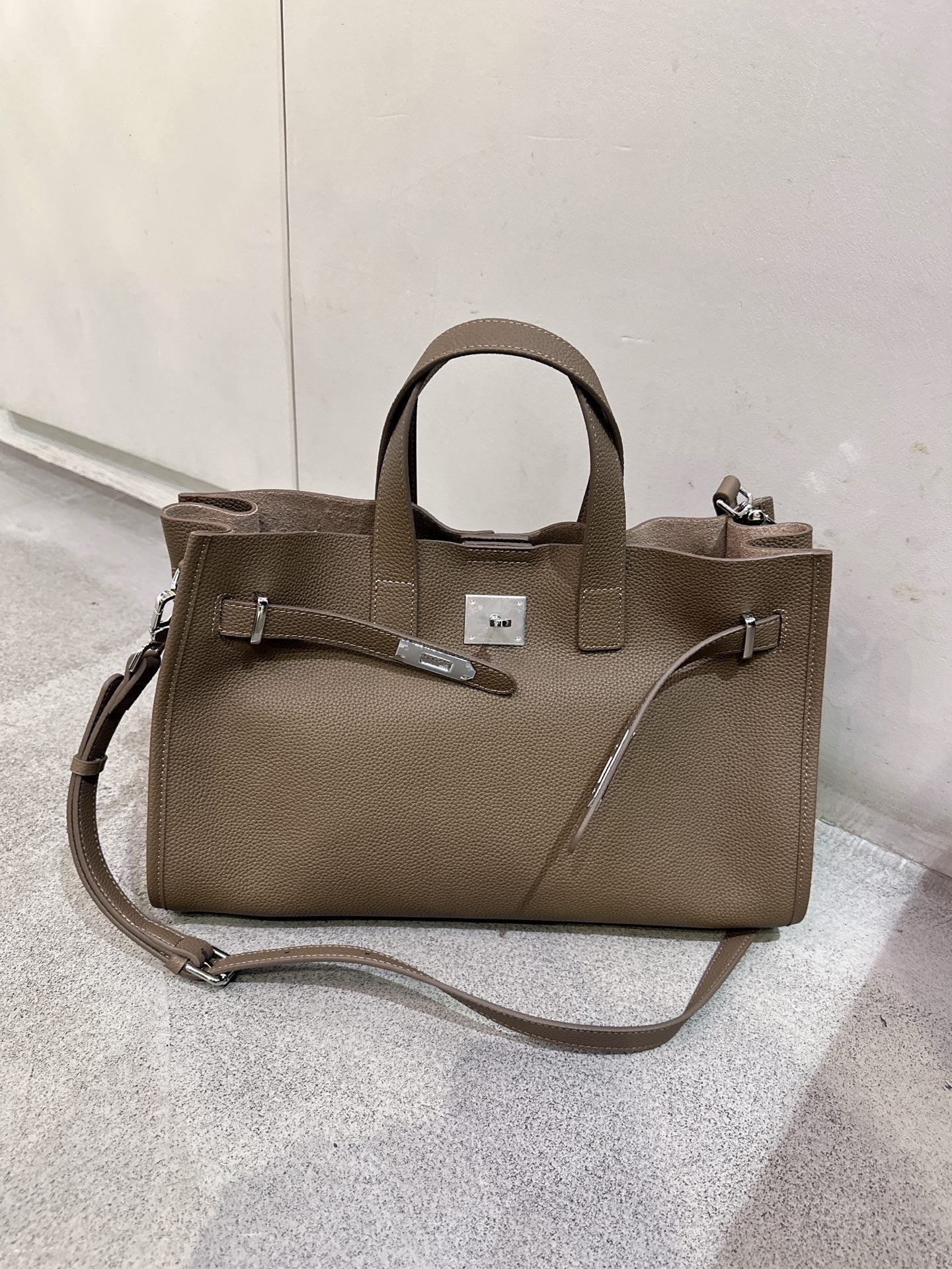 Black cowhide crossbody bag for women with adjustable strap, featuring a sleek all-match design from Plush Fashion Hub.