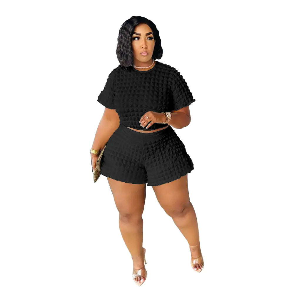 Plus size women's casual summer two-piece set featuring trendy shorts and top, stylish and comfortable for warm weather.